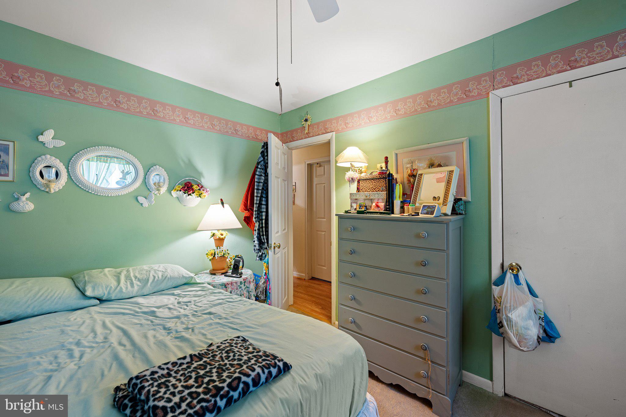3302 Barratts Chapel Road Frederica, DE 19946 - Photo 17 of 19 a bedroom with a bed and a dresser