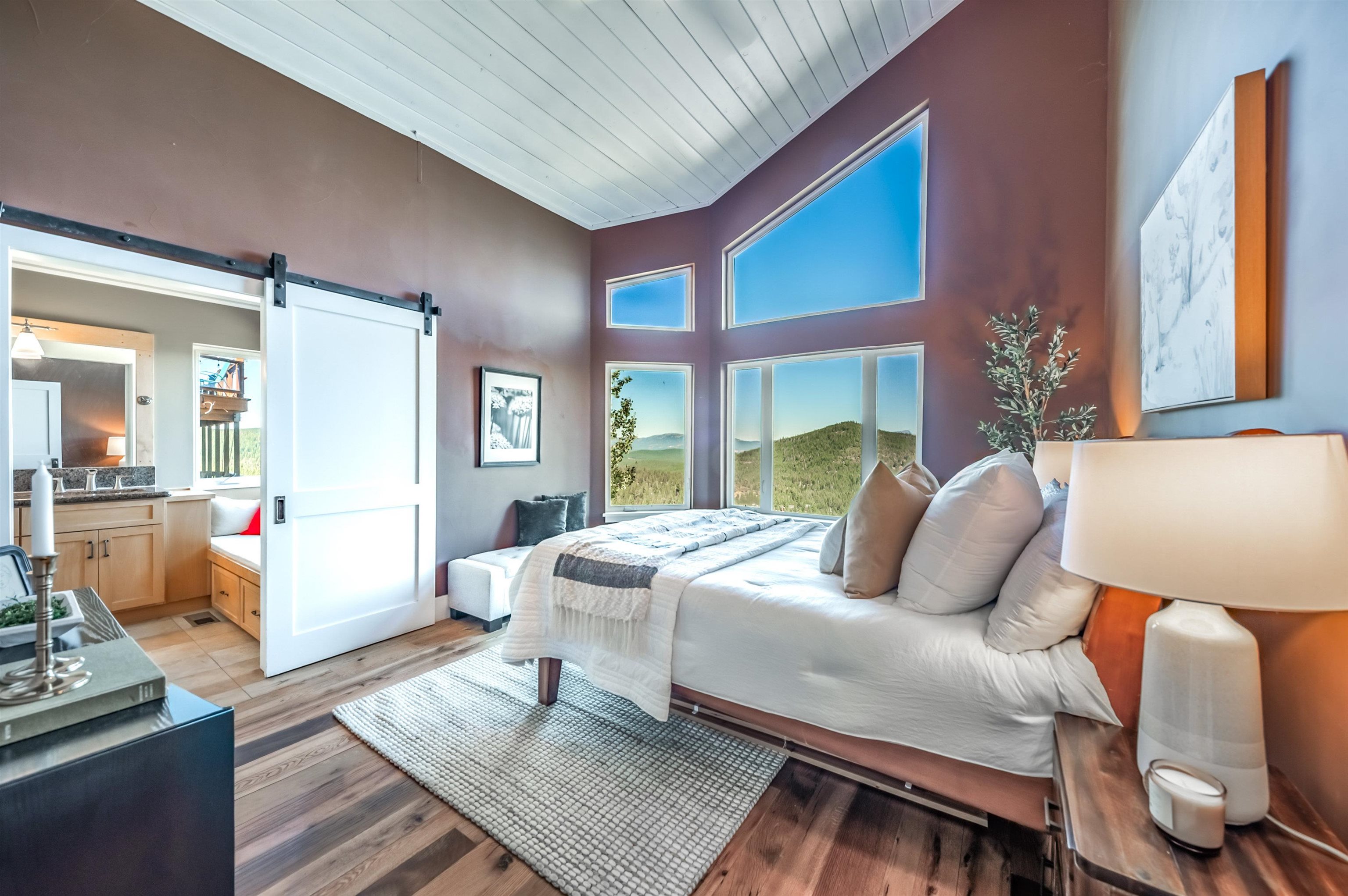 12957 Pinnacle Loop, Unit 6 Truckee, CA 96161 - Photo 13 of 28 a bedroom with a bed wooden floor and window