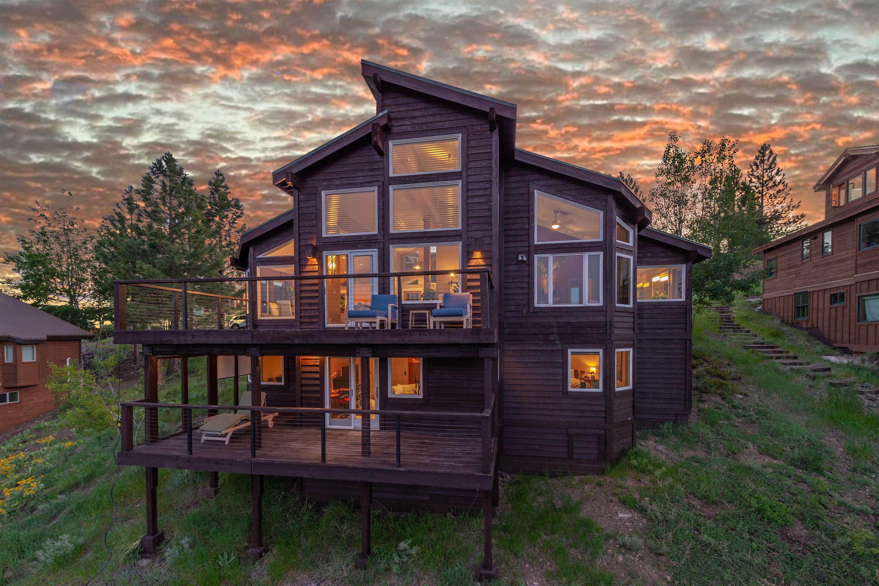 12957 Pinnacle Loop, Unit 6 Truckee, CA 96161 - Photo 21 of 28 a view of a brick house with a small yard and deck