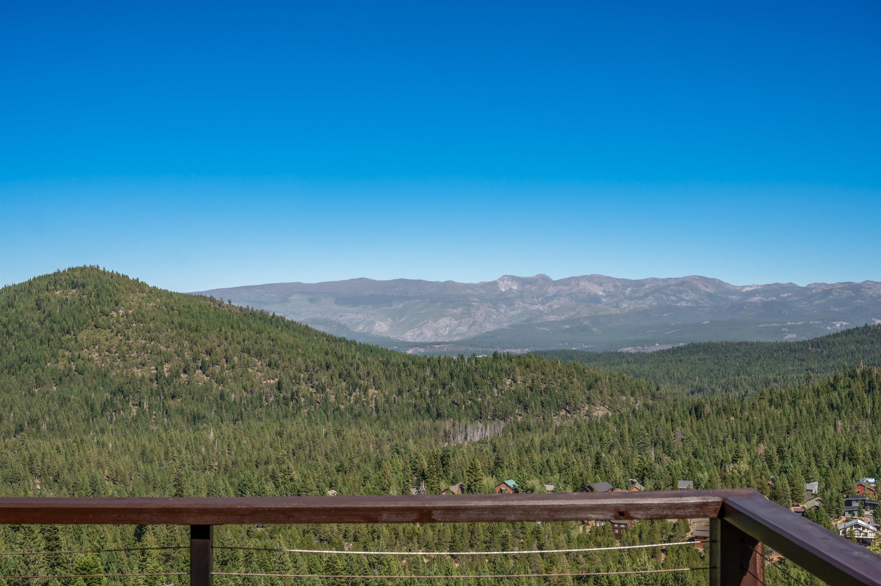 12957 Pinnacle Loop, Unit 6 Truckee, CA 96161 - Photo 27 of 28 a view of a forest with a mountain