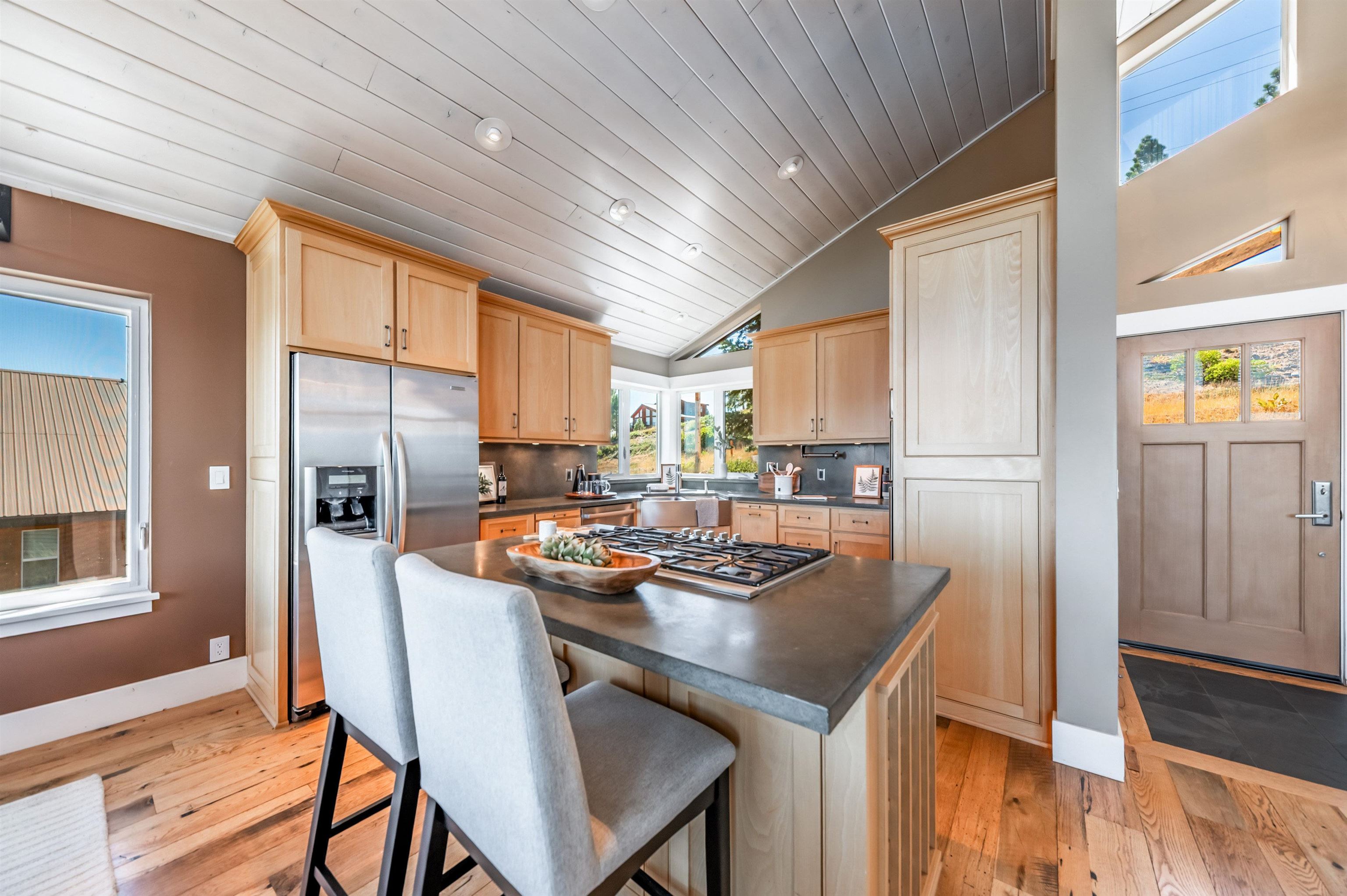 12957 Pinnacle Loop, Unit 6 Truckee, CA 96161 - Photo 6 of 28 a kitchen with refrigerator and cabinets