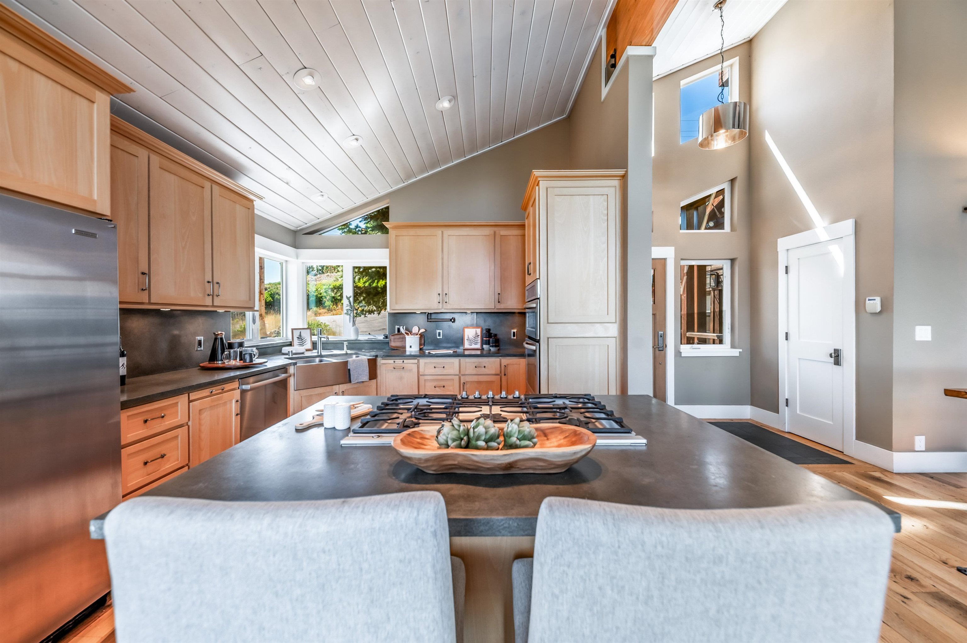 12957 Pinnacle Loop, Unit 6 Truckee, CA 96161 - Photo 7 of 28 a kitchen with a table chairs sink and cabinets