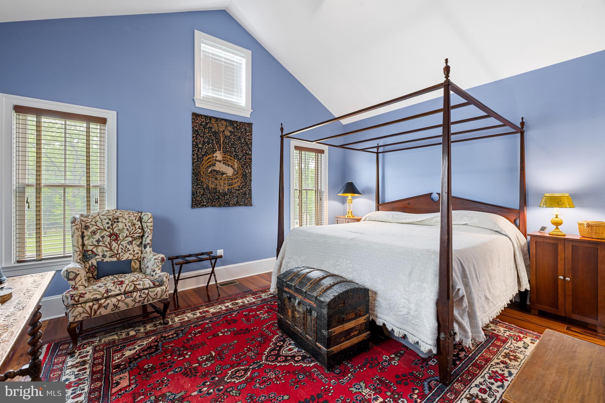 20147 Woodtrail Road Round Hill, VA 20141 - Photo 24 of 41 a bedroom with a bed and wooden floor