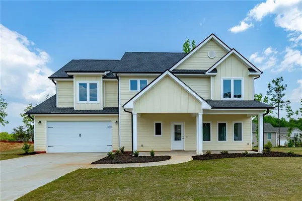 a front view of a house with a yard