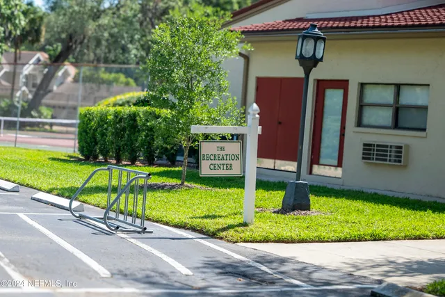 a view of outdoor space with signage and trees