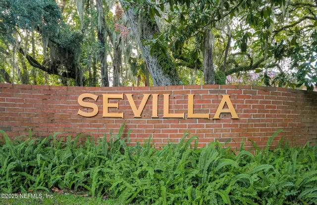 a front view of a house with swimming pool having outdoor seating