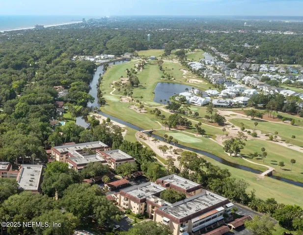 a view of a swimming pool with lounge chair