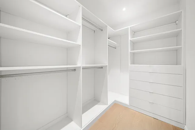 a view of an empty walk in closet