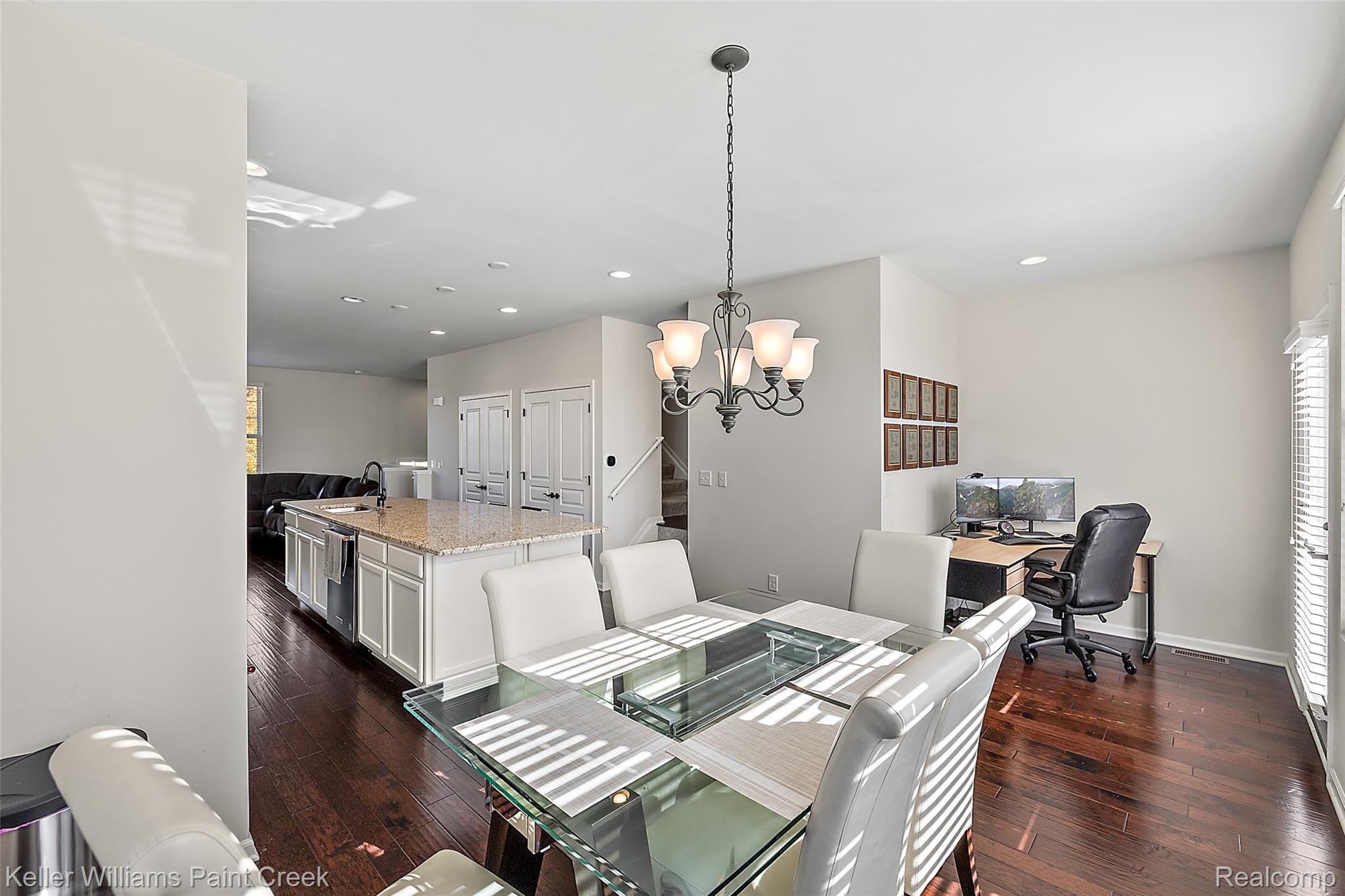 314 Glenhurst Boulevard Rochester, MI 48307 - Photo 17 of 64 Dining space featuring a desk, a chandelier, dark wood-style flooring, stairway, and recessed lighting
