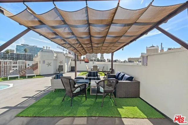 a patio with table and chairs