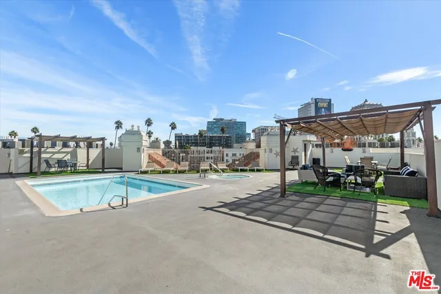 a view of a swimming pool with a patio