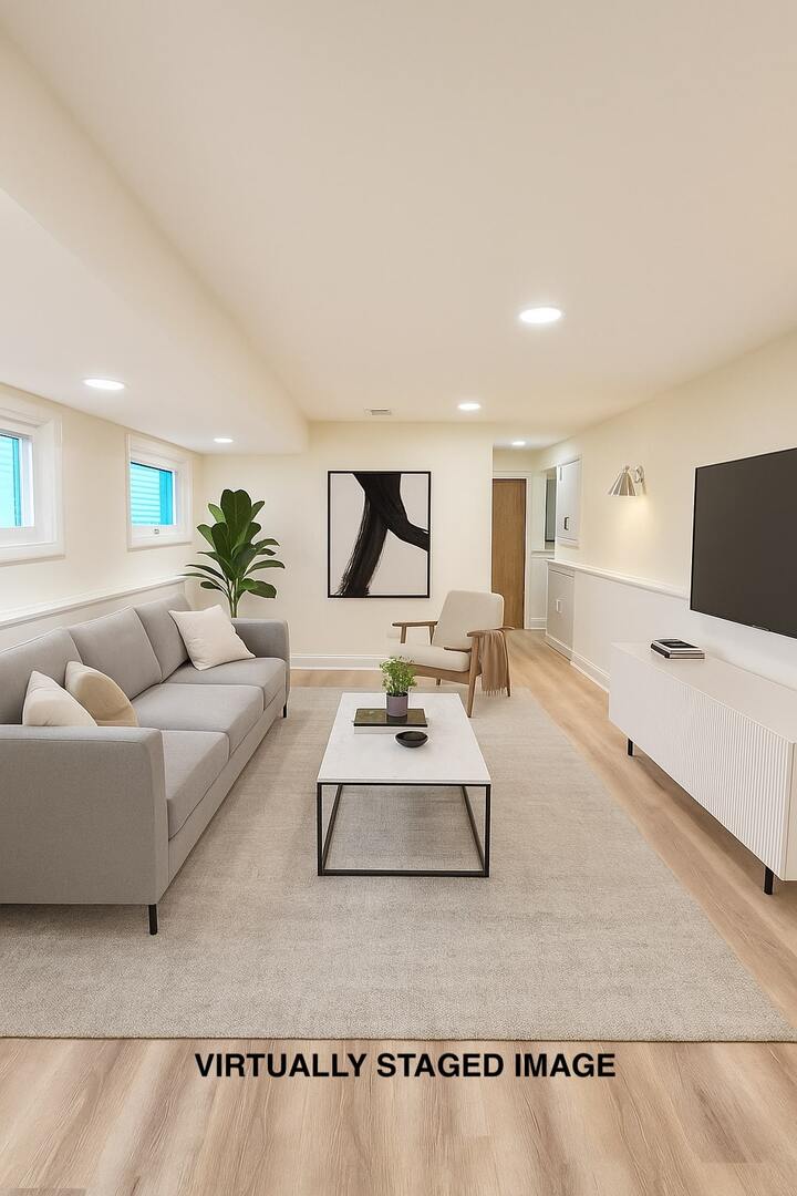 7434 Emerson Street Morton Grove, IL 60053 - Photo 26 of 38 a living room with furniture and a flat screen tv