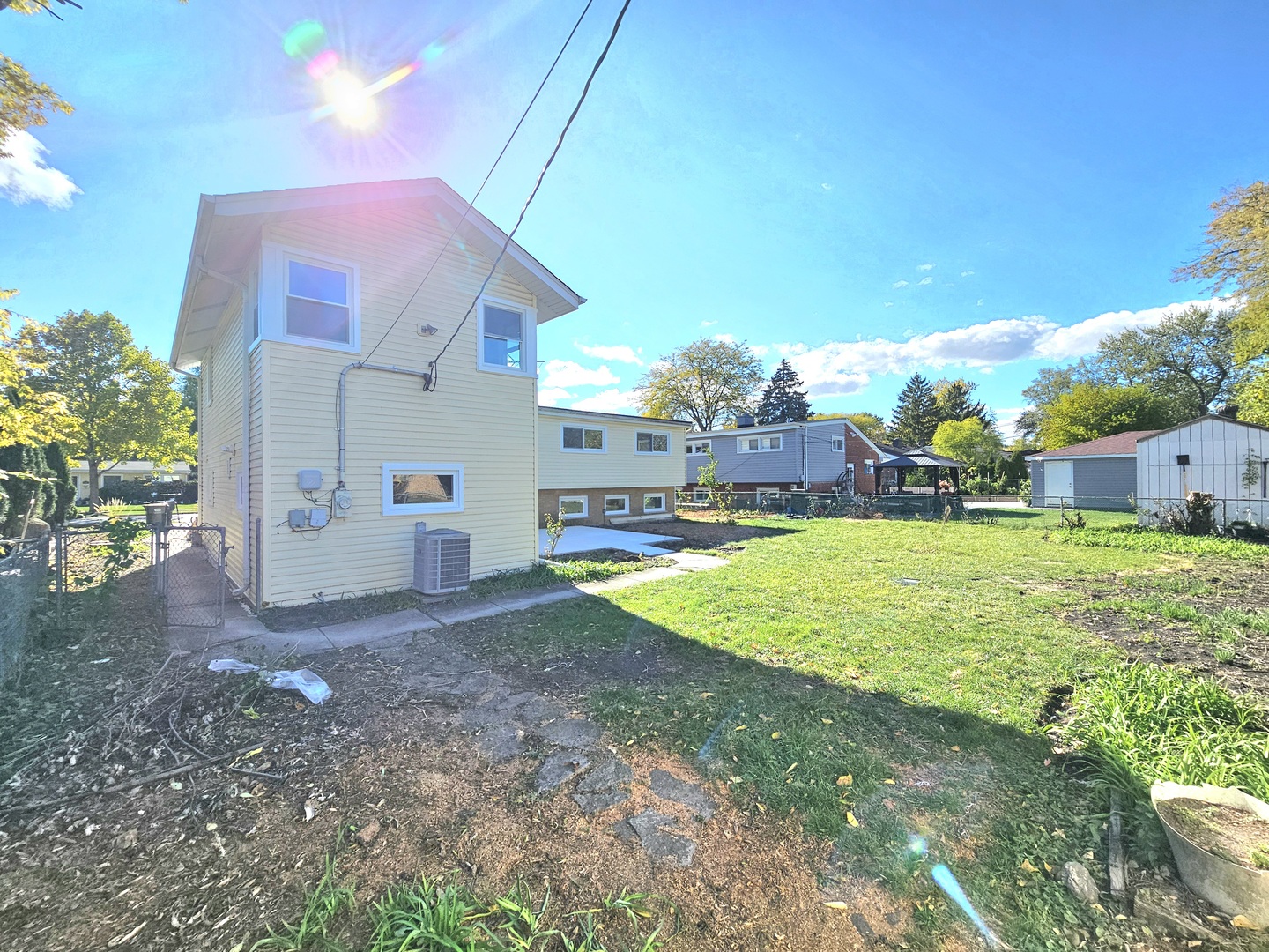 7434 Emerson Street Morton Grove, IL 60053 - Photo 32 of 38 a view of a house with a yard and a garage