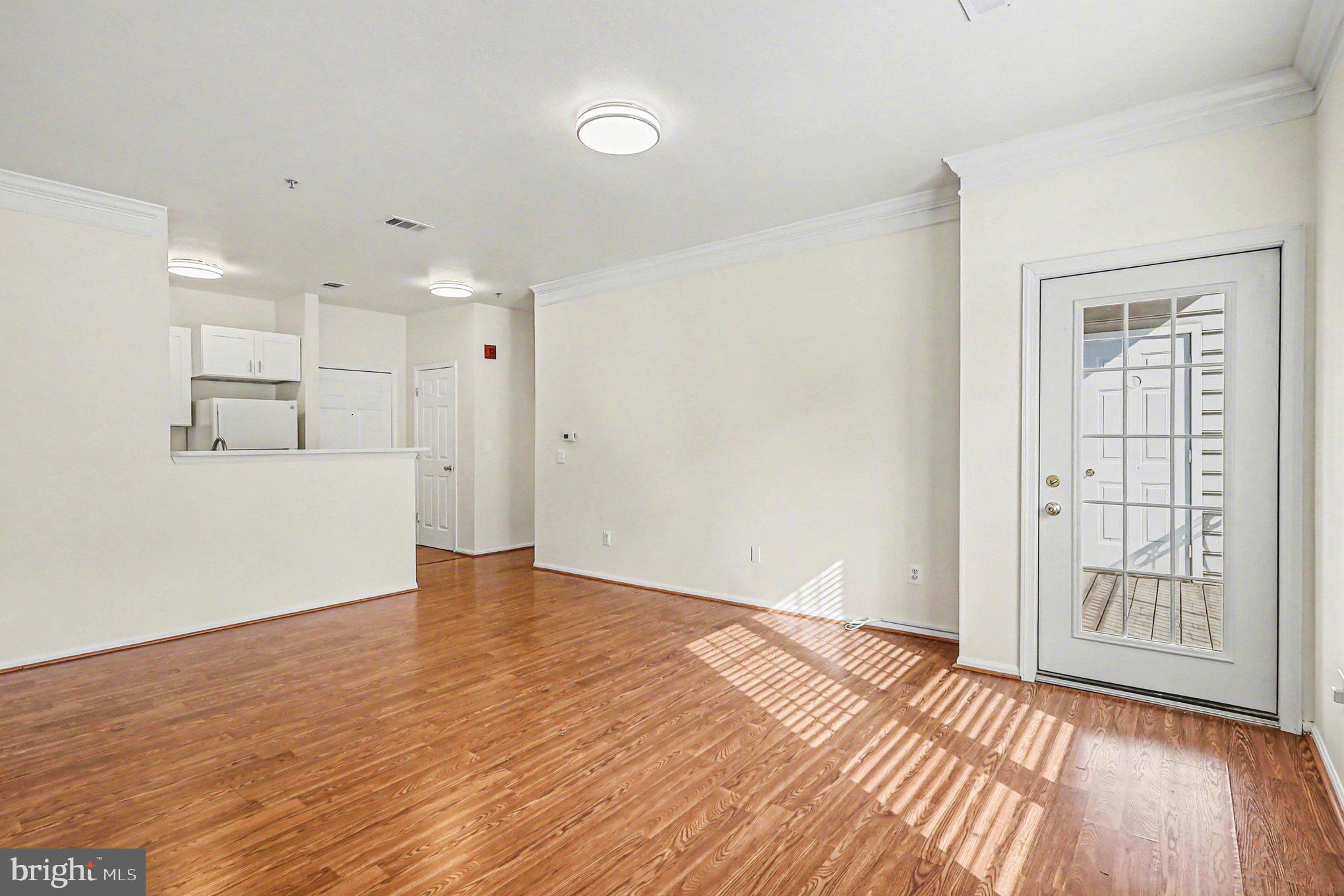 1570 Spring Gate Dr., Unit 7201 McLean, VA 22102 - Photo 8 of 20 Living room and access to the balcony