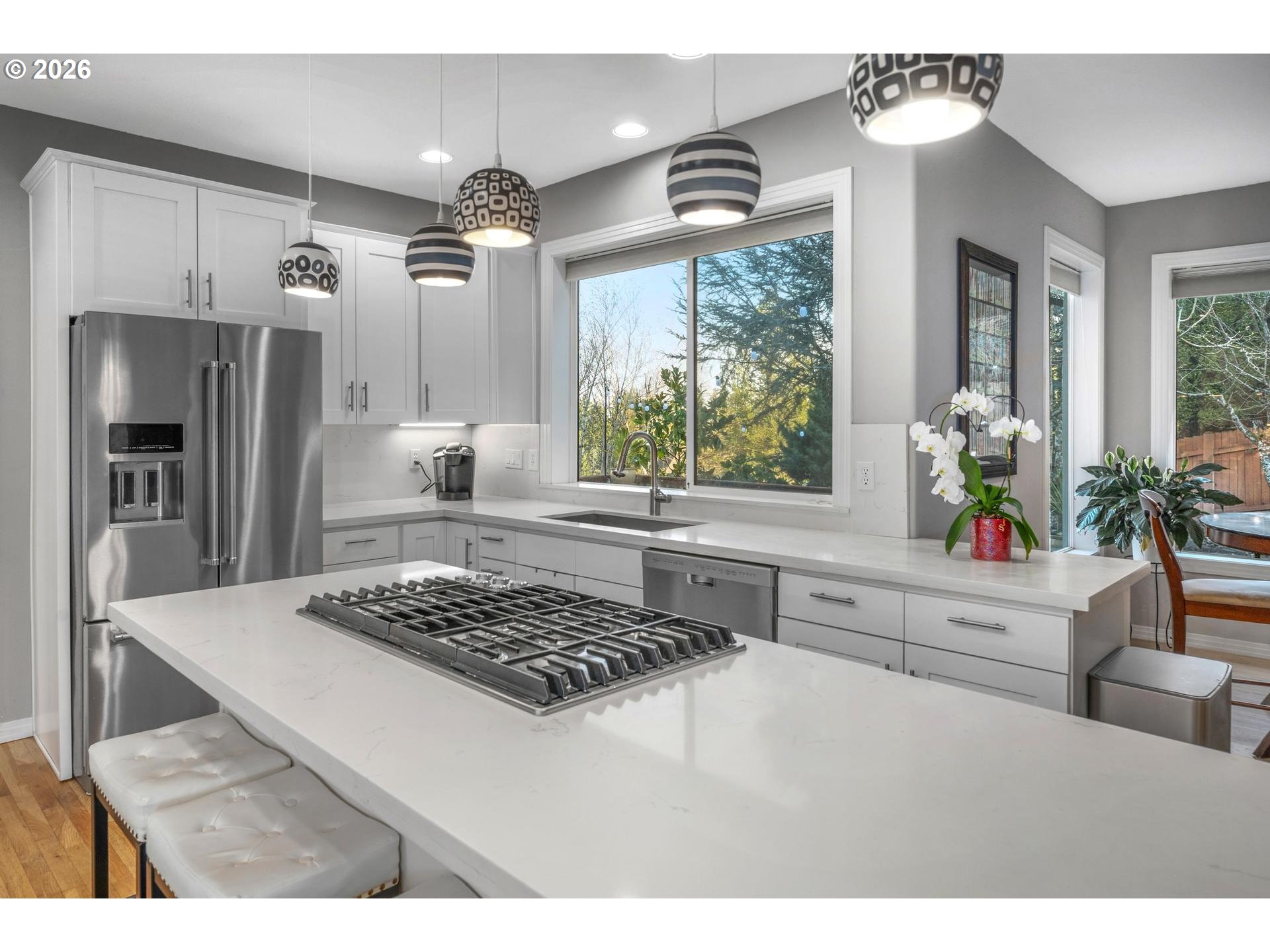 13072 Southwest Morningstar Drive Portland, OR 97223 - Photo 14 of 48 a kitchen with a stove a refrigerator and a view of living room