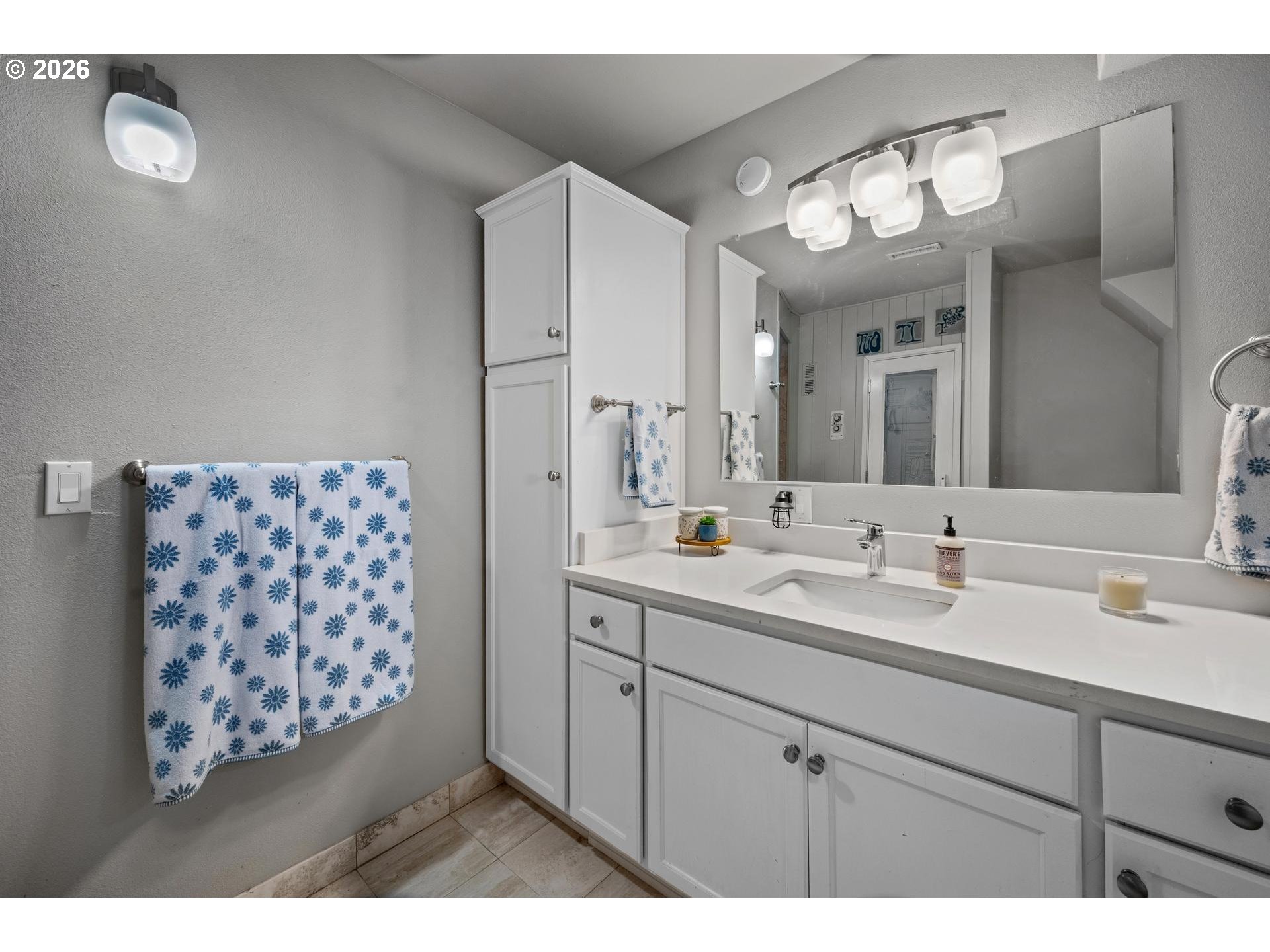 13072 Southwest Morningstar Drive Portland, OR 97223 - Photo 31 of 48 a bathroom with a sink a mirror and a shower