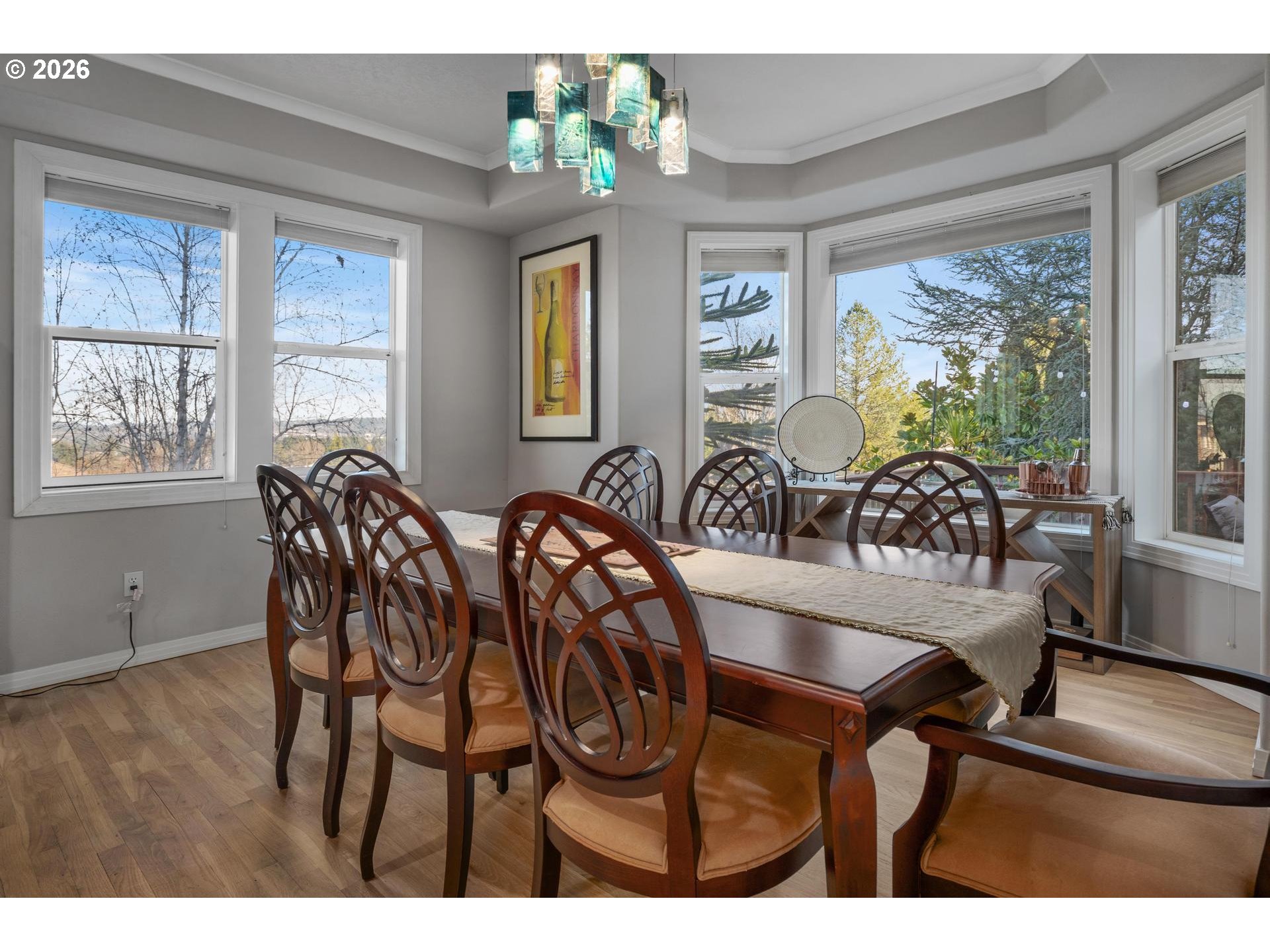 13072 Southwest Morningstar Drive Portland, OR 97223 - Photo 7 of 48 a view of a dining room with furniture a chandelier and wooden floor