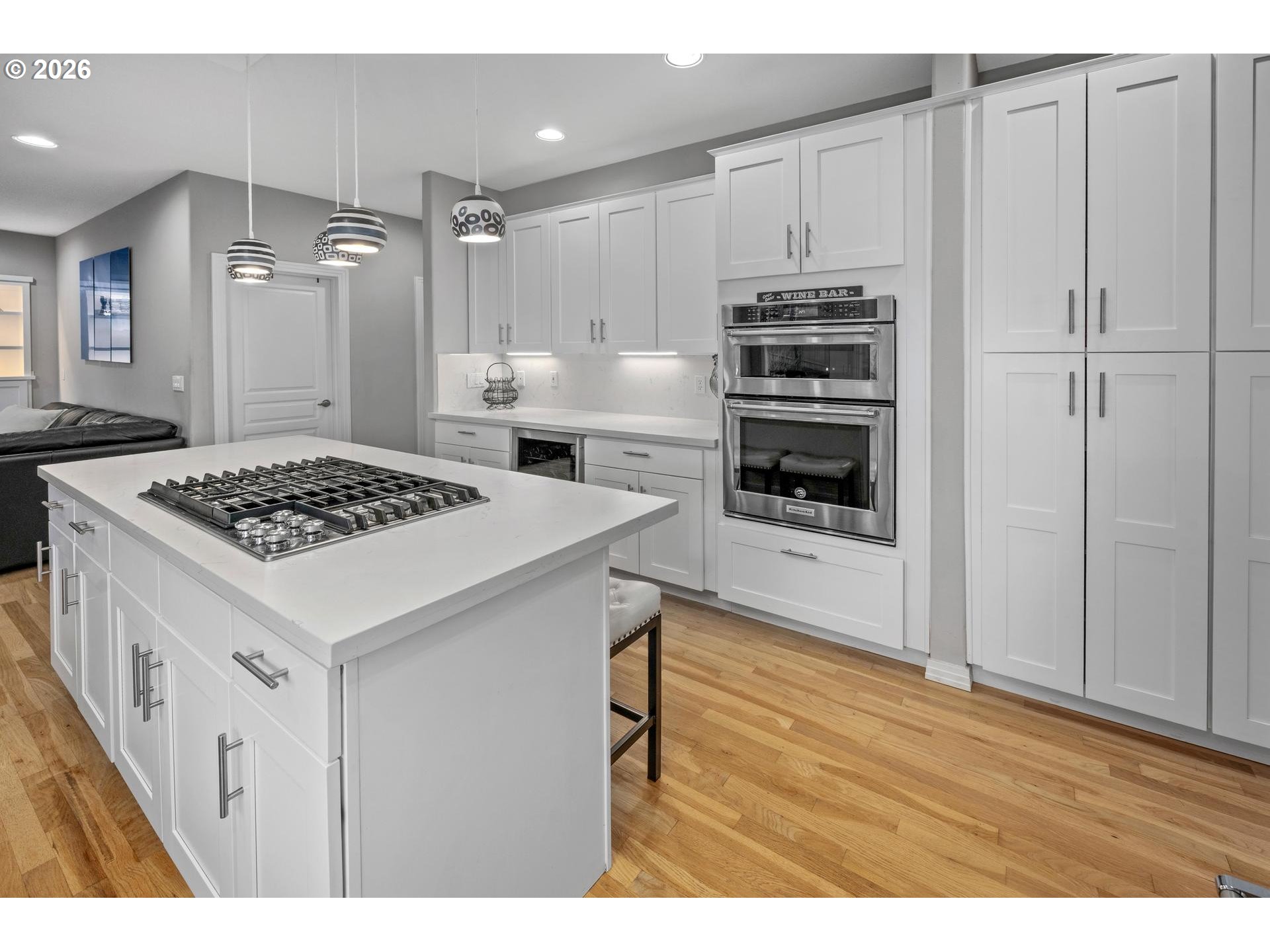 13072 Southwest Morningstar Drive Portland, OR 97223 - Photo 10 of 48 a kitchen with stainless steel appliances kitchen island granite countertop a stove and a refrigerator