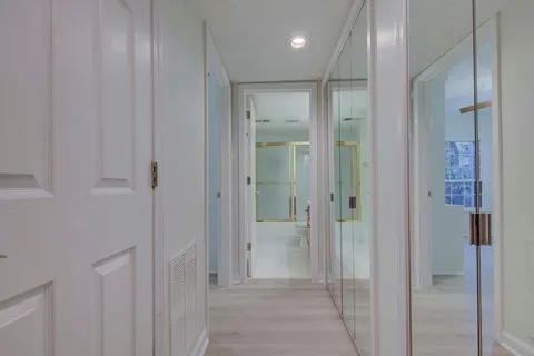 a bathroom with a glass shower door