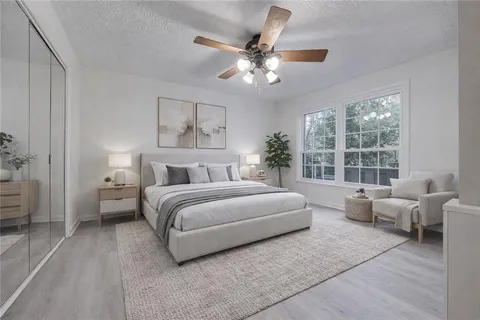 a bedroom with a large bed and furniture