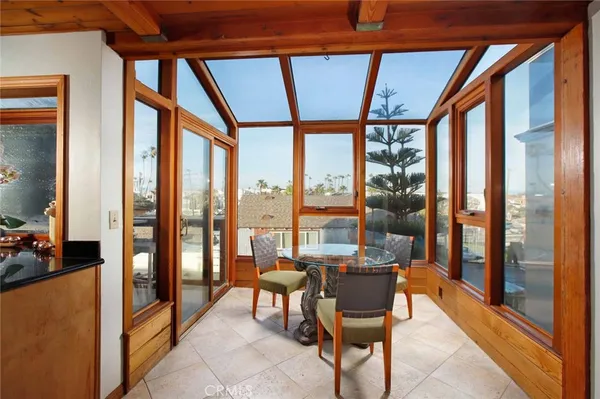 a room with furniture and large windows