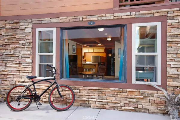 a view of front door of house with a large window
