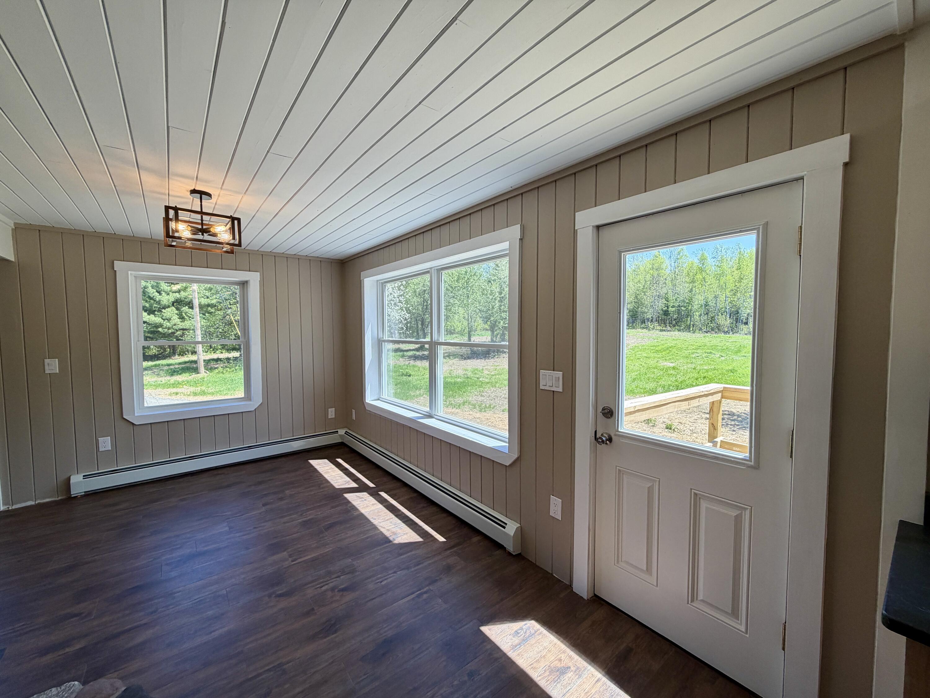 51 Big Boyd Lake Road Milo, ME 04463 - Photo 23 of 64 Living Room Door to Deck