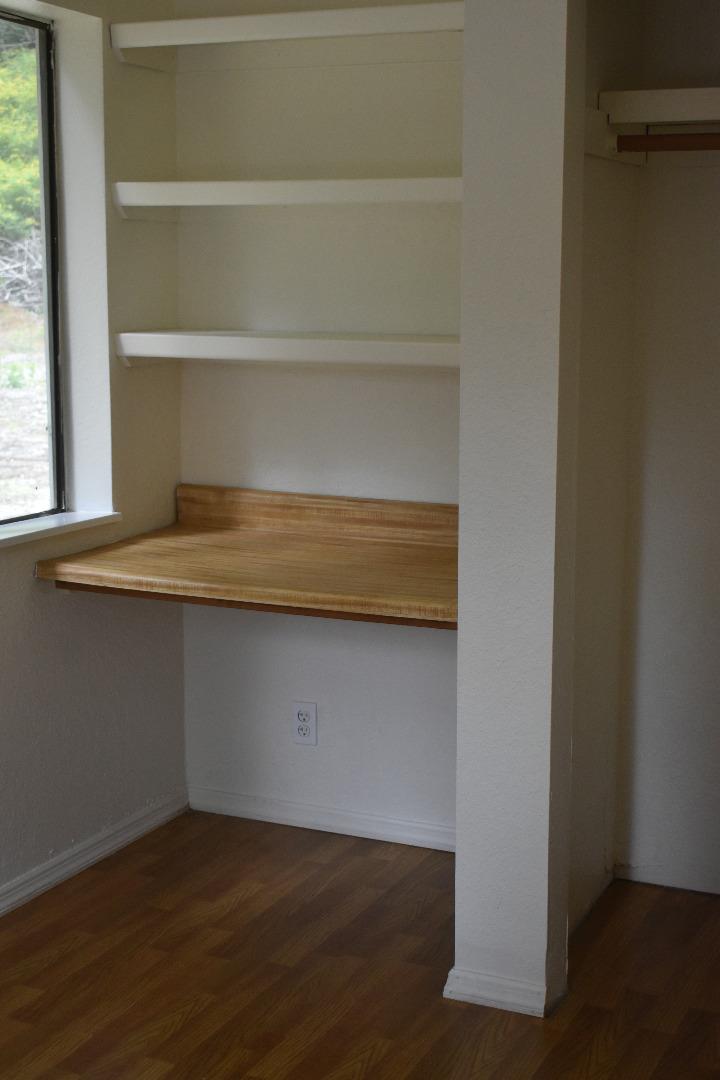 12025 Alba Road Ben Lomond, CA 95005 - Photo 15 of 17 a view of storage and utility room with wooden floor and a window