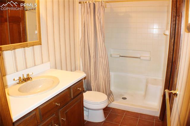 2465 Evergreen Road Colorado Springs, CO 80921 - Photo 13 of 25 His own bath adjoining the master room