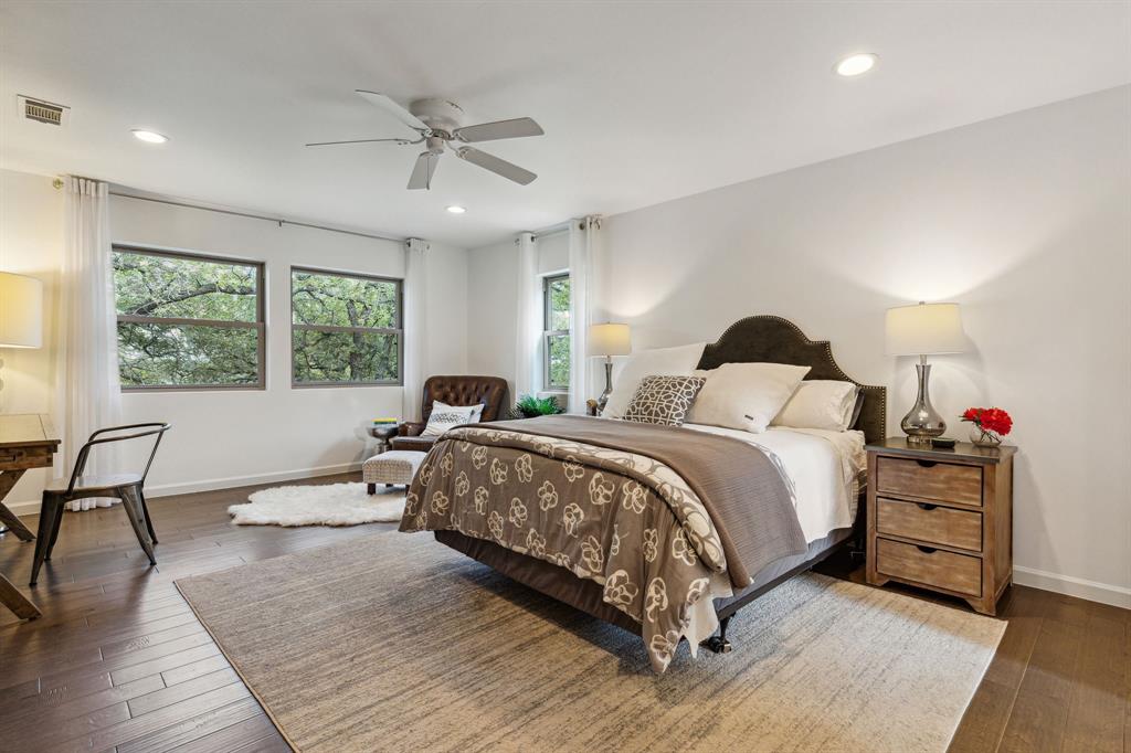 7342 Briar Road Azle, TX 76020 - Photo 14 of 40 a bedroom with a bed and wooden floor