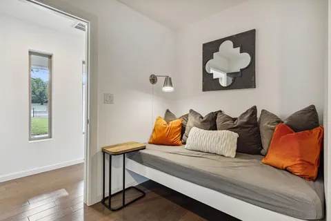 a bedroom with furniture and a window