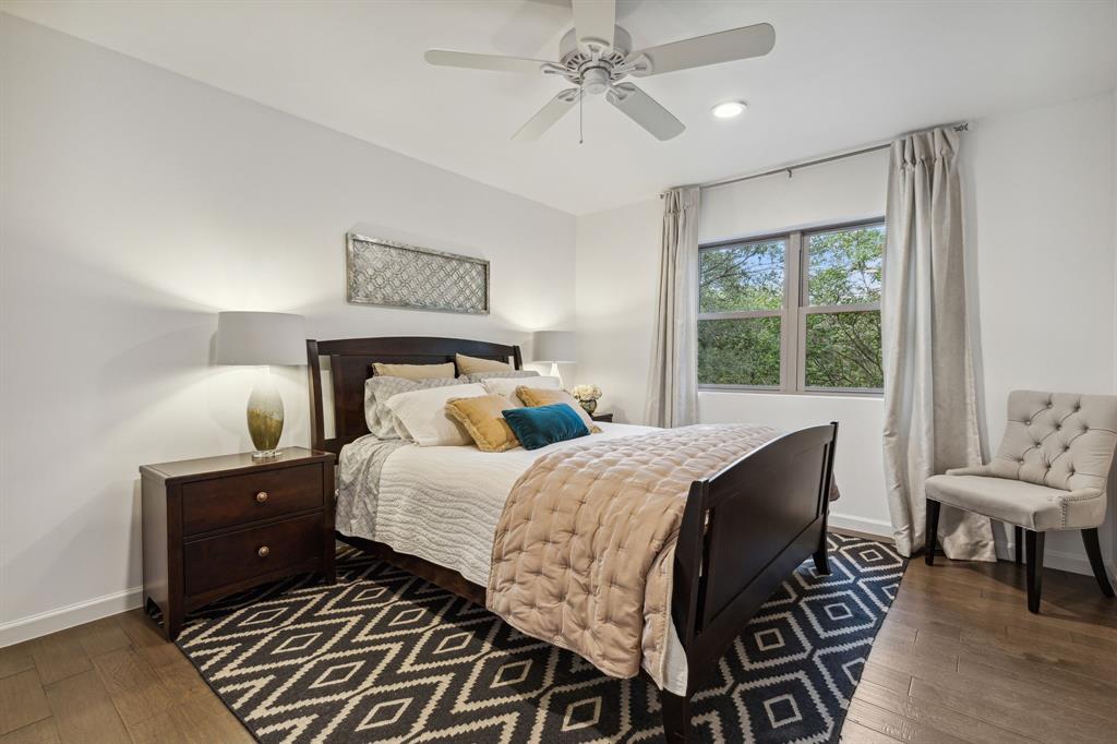 7342 Briar Road Azle, TX 76020 - Photo 19 of 40 a bedroom with a bed and wooden floor