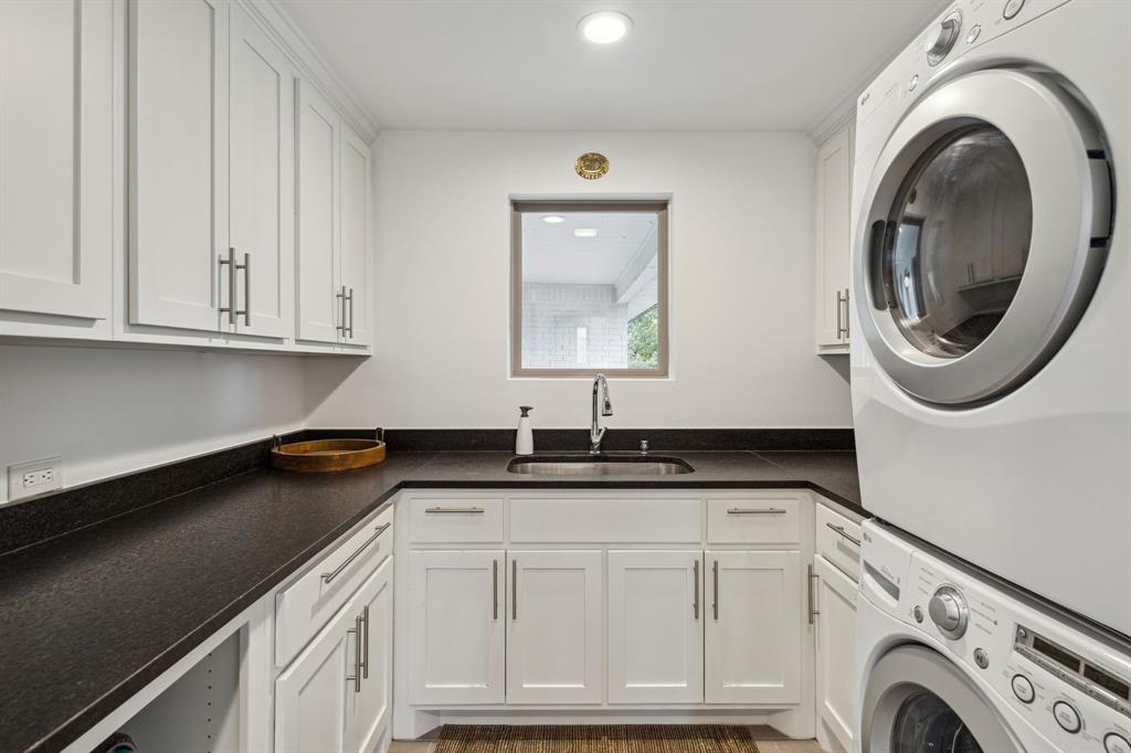 7342 Briar Road Azle, TX 76020 - Photo 22 of 40 a utility room with granite countertop a sink and a washer dryer