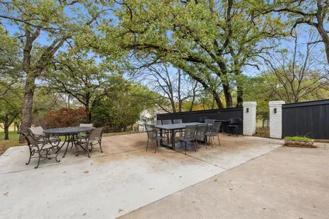a view of a yard with wooden fence and floor