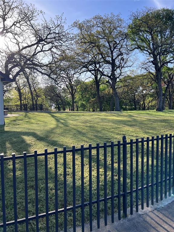 7342 Briar Road Azle, TX 76020 - Photo 32 of 40 a view of a yard with wooden fence and floor