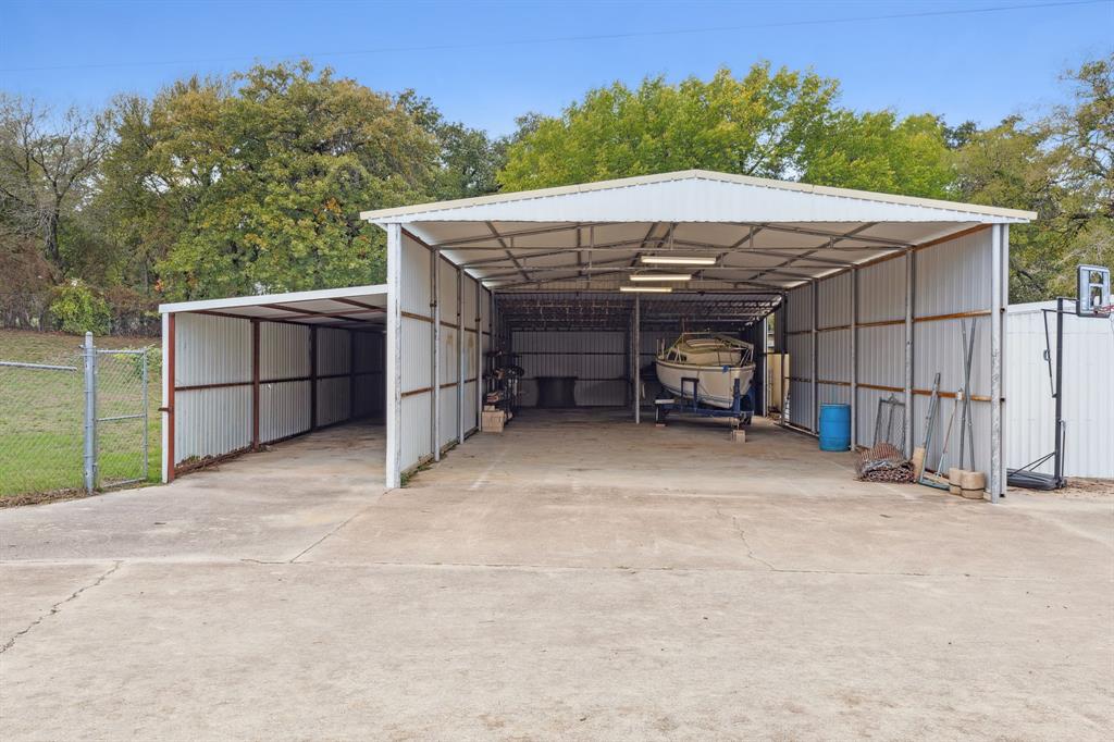 7342 Briar Road Azle, TX 76020 - Photo 38 of 40 View of parking / parking lot featuring a tall carport perfect to park RV and/or boat