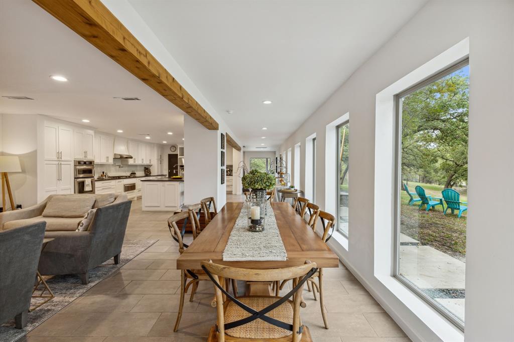 7342 Briar Road Azle, TX 76020 - Photo 9 of 40 a view of a dining room with furniture window and wooden floor
