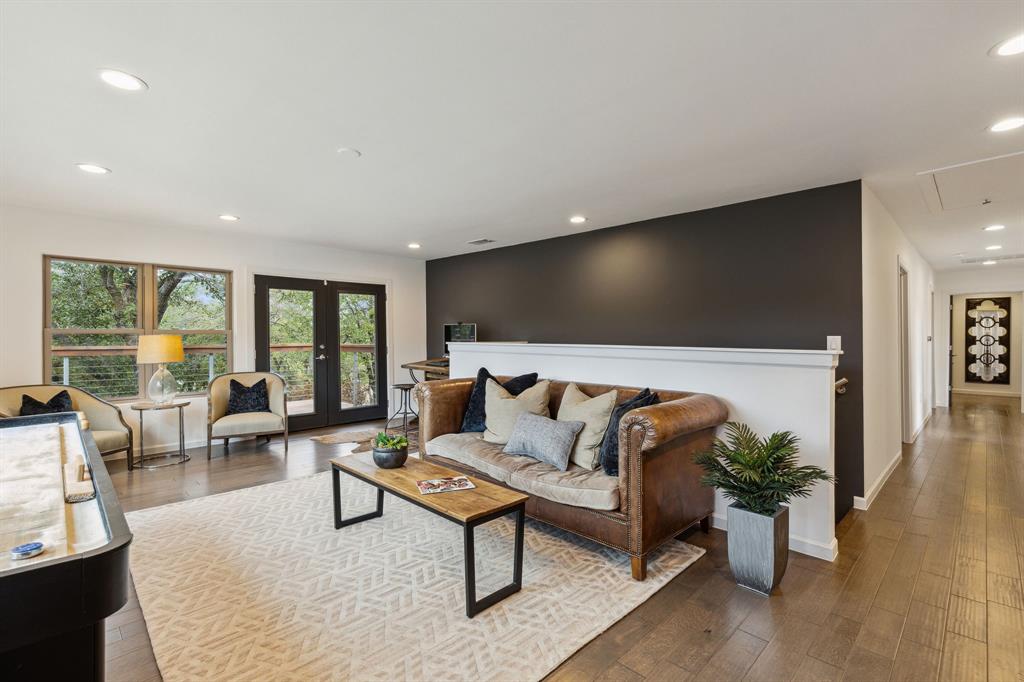 7342 Briar Road Azle, TX 76020 - Photo 10 of 40 a living room with furniture and a flat screen tv