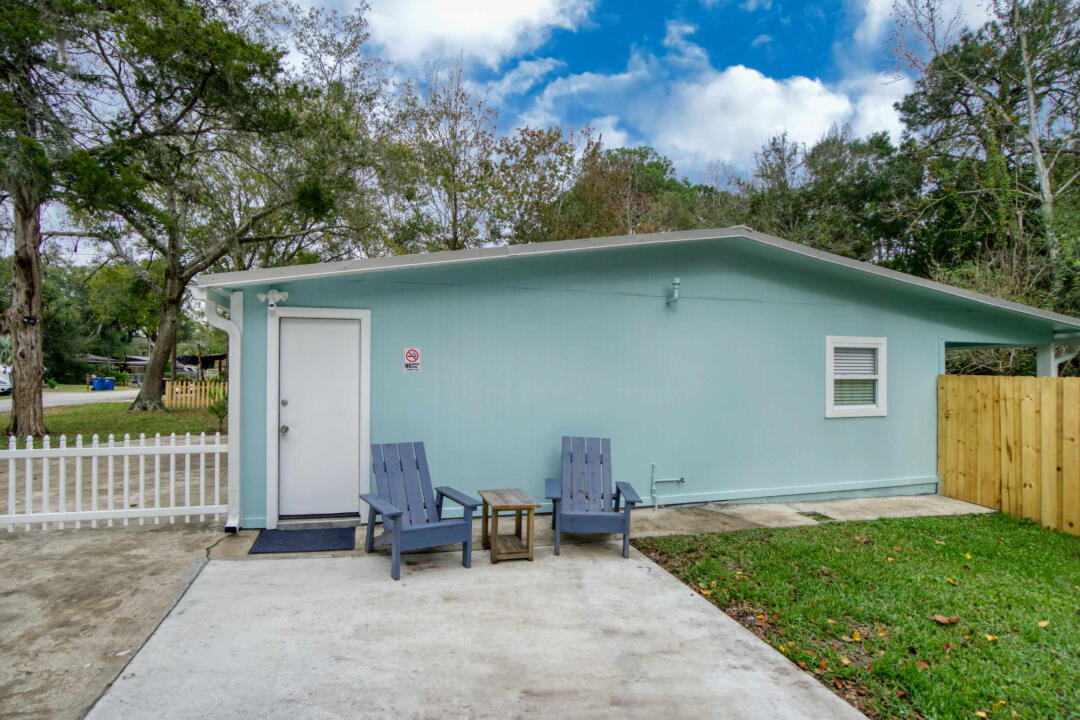 107 Lighthouse Road North Jacksonville, FL 32225 - Photo 31 of 43 a backyard of a house with table and chairs