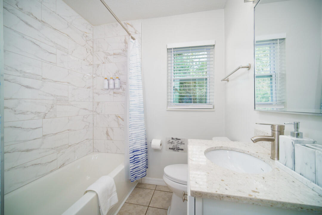107 Lighthouse Road North Jacksonville, FL 32225 - Photo 6 of 43 a bathroom with a sink a bathtub and a toilet