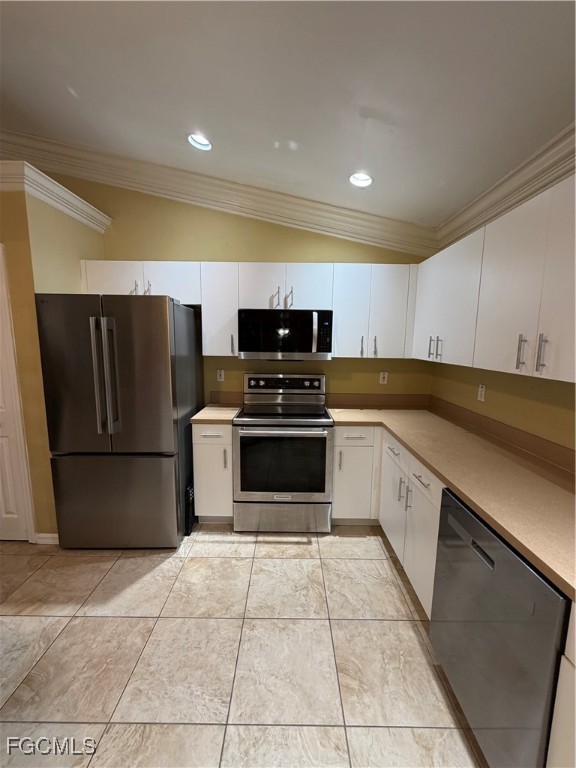 4621 30th Street Southwest Lehigh Acres, FL 33973 - Photo 2 of 8 a kitchen with a stove a refrigerator and a sink