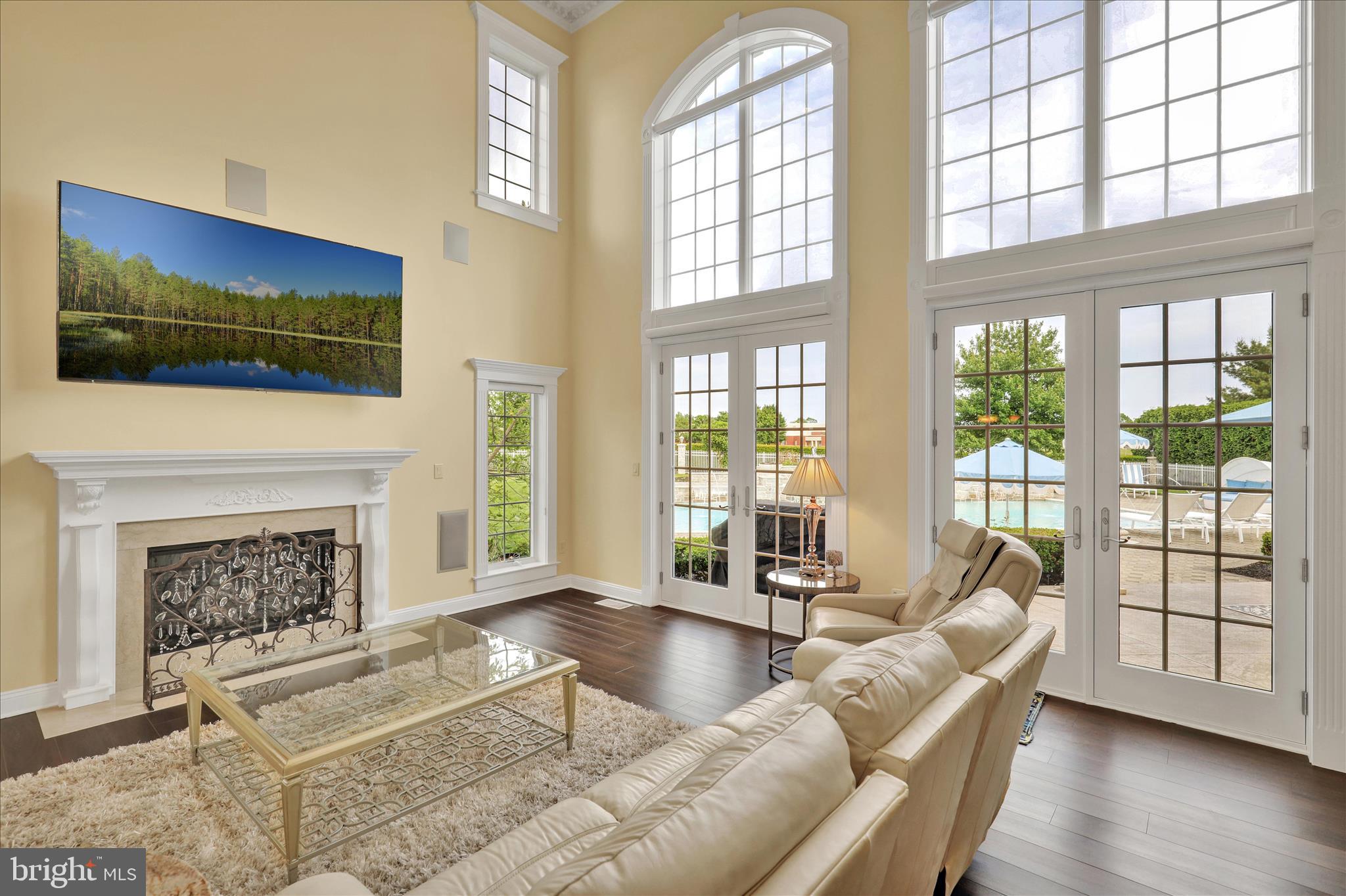 1000 Bluestone Drive Lititz, PA 17543 - Photo 46 of 132 a living room with furniture fireplace and floor to ceiling windows
