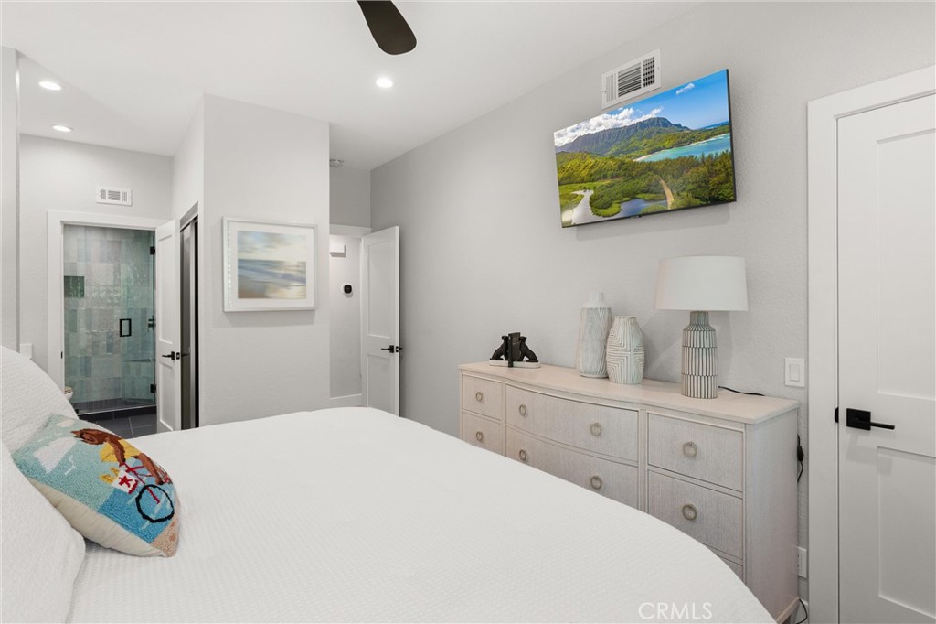 26 Sunbridge Place Dana Point, CA 92629 - Photo 16 of 39 a bedroom with a bed and a cabinets