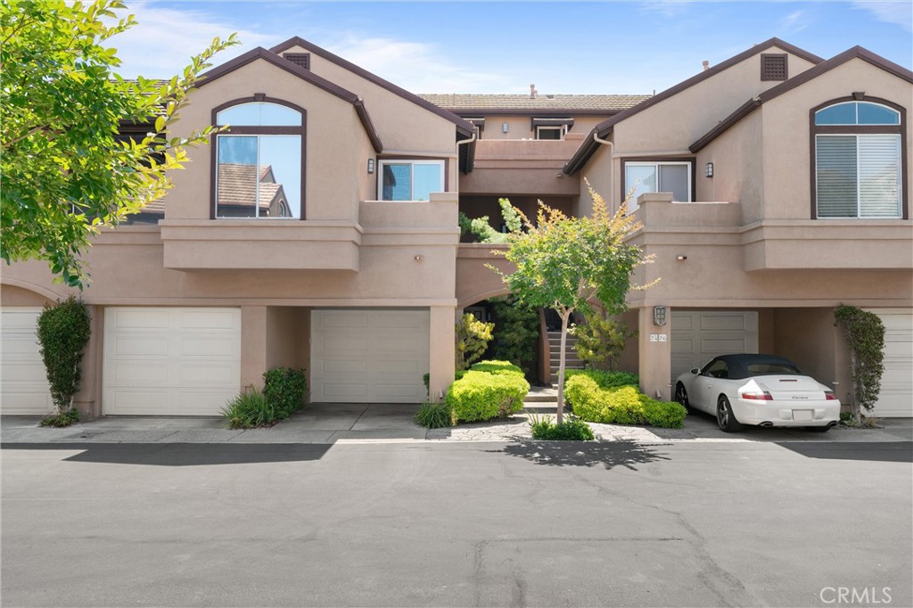 26 Sunbridge Place Dana Point, CA 92629 - Photo 25 of 39 a front view of a house with a yard and garage