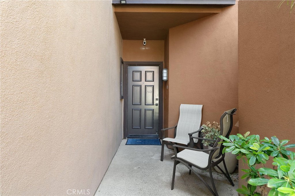 26 Sunbridge Place Dana Point, CA 92629 - Photo 26 of 39 a view of a door and chair in the back yard