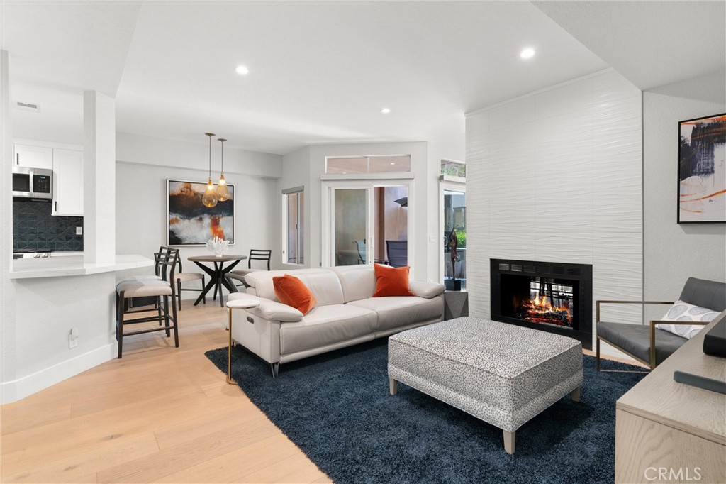 26 Sunbridge Place Dana Point, CA 92629 - Photo 3 of 39 a living room with furniture and a fireplace