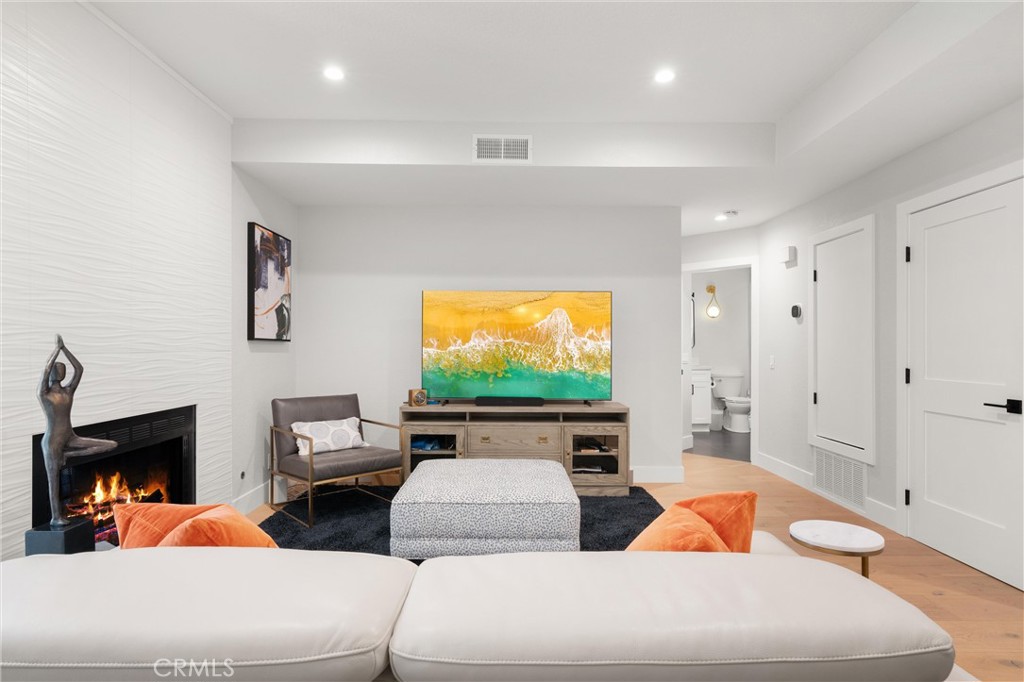 26 Sunbridge Place Dana Point, CA 92629 - Photo 5 of 39 a living room with furniture and a flat screen tv