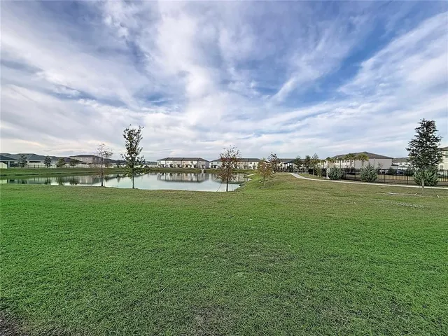 a view of a golf course with a lake