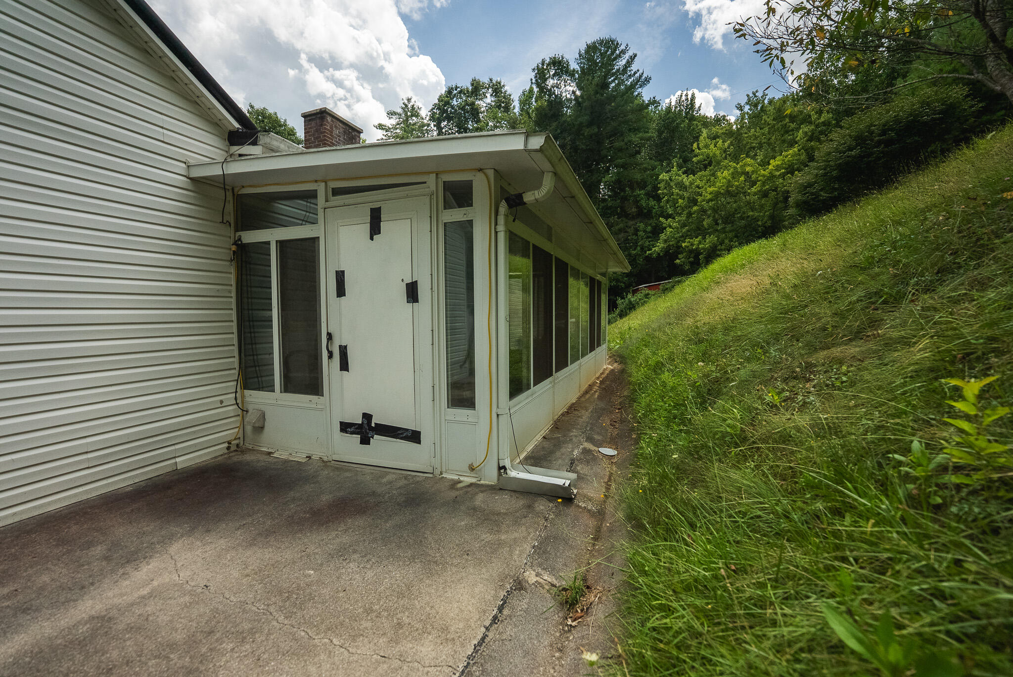 4752 Webbs Mill Road North Riner, VA 24149 - Photo 6 of 50 a view of a small house with potted plants