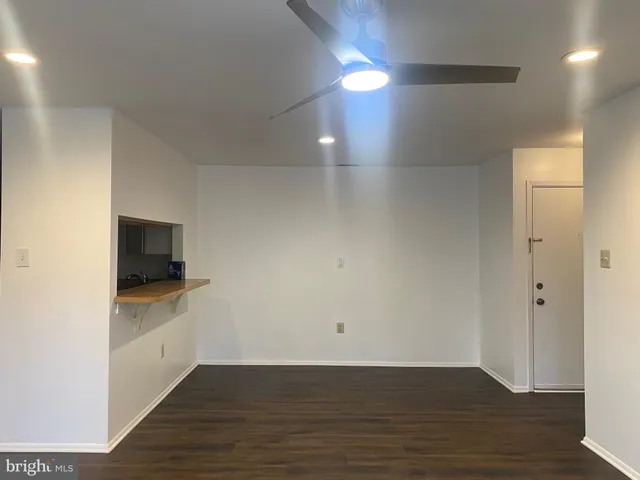 a view of a kitchen cabinets and wooden floor